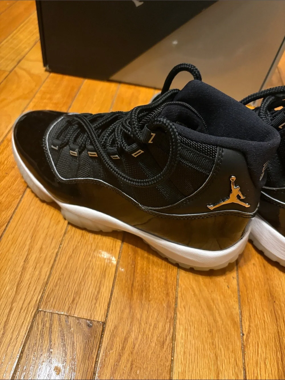 Air Jordan 11 Retro Black Patent and White-Trim High-Top Sneakers